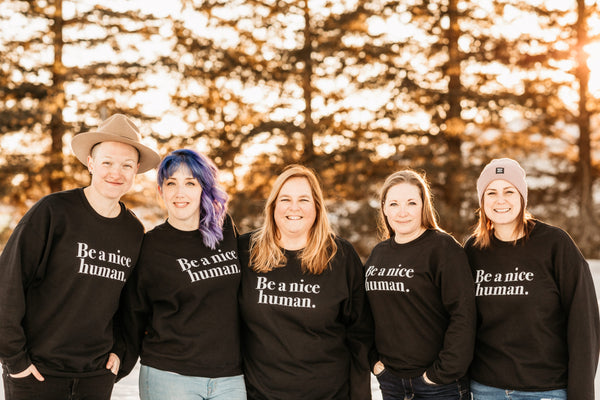 Christine, Lyndsay and others wearing 'be a nice human sweatshirt'.