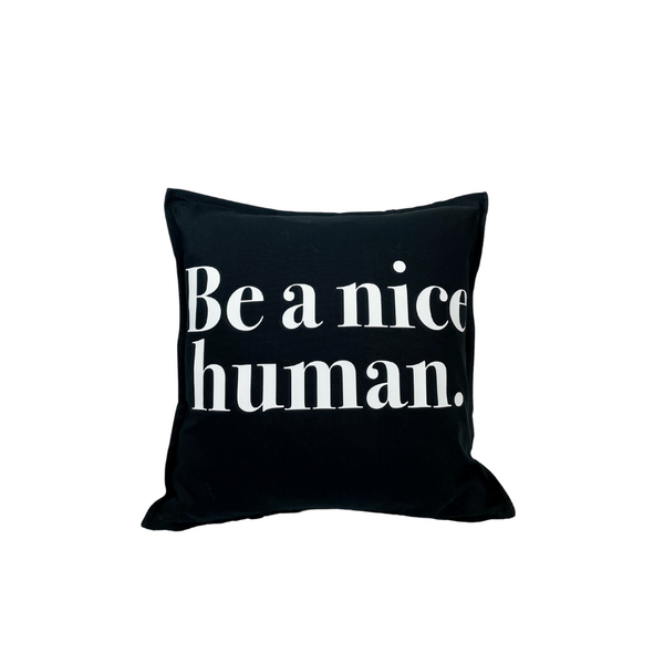 black pillow with saying be a nice human 