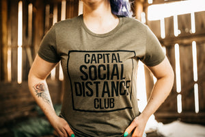 Green shirt with saying Social Distance Club