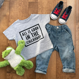 toddler t shirt with saying "all is good in the childhood", toddler jeans, toddler, shoes, and stuffed frog animal 